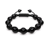 Men's black onyx bracelet on a braided cord with slide closure