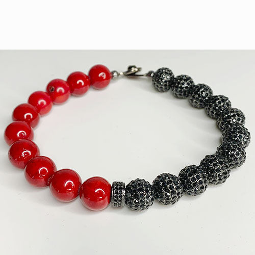Red Gemstone On Black Ice